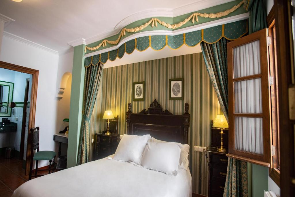 Posteľ alebo postele v izbe v ubytovaní Hotel Soho Boutique Palacio San Gabriel
