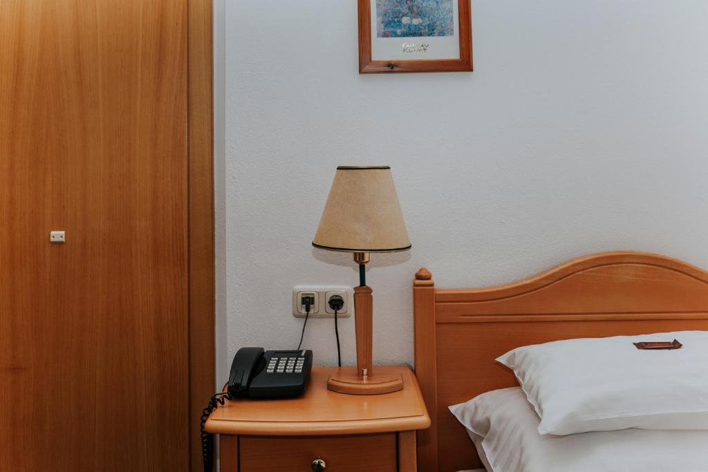 Posteľ alebo postele v izbe v ubytovaní Hotel Friesacherhof