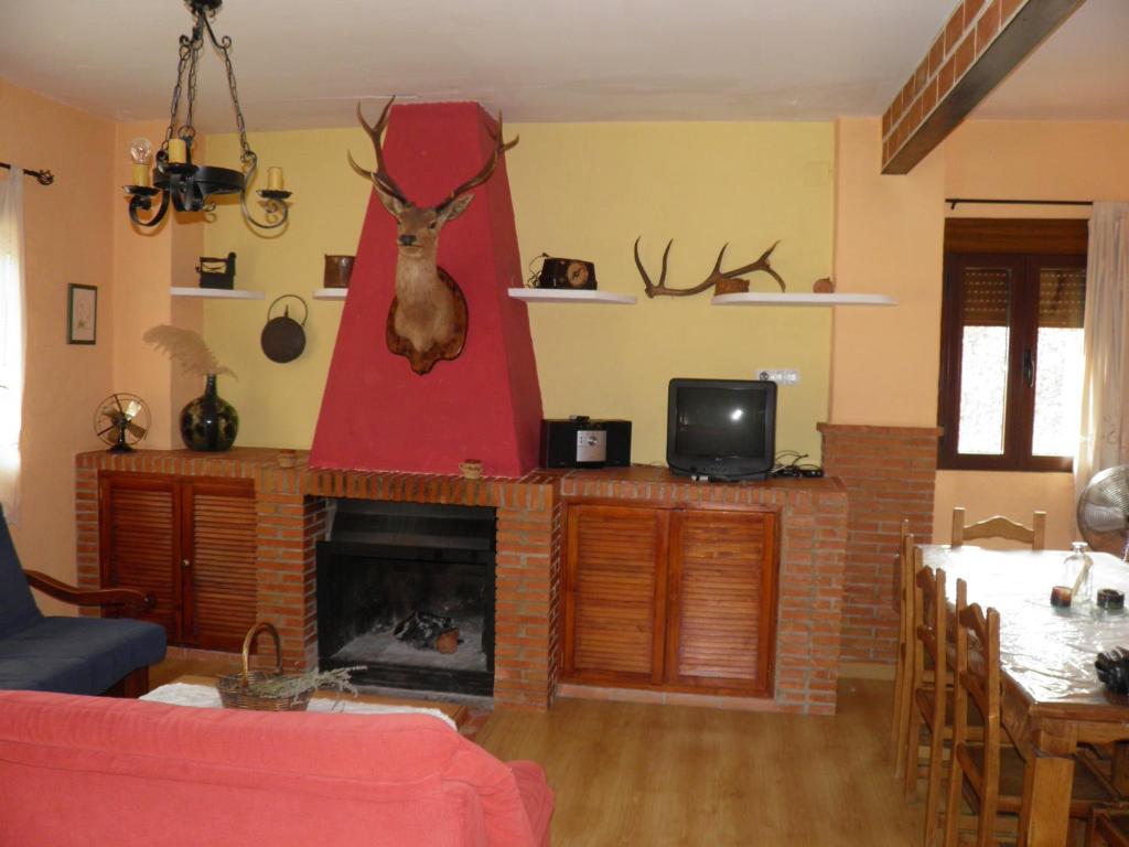 Televízia a/alebo spoločenská miestnosť v ubytovaní Casa el Tío Enrique