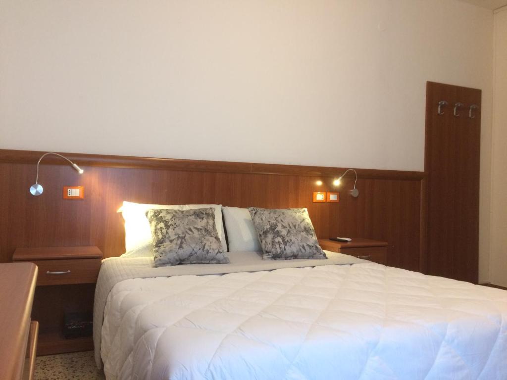 Postel nebo postele na pokoji v ubytování Hotel Portofino