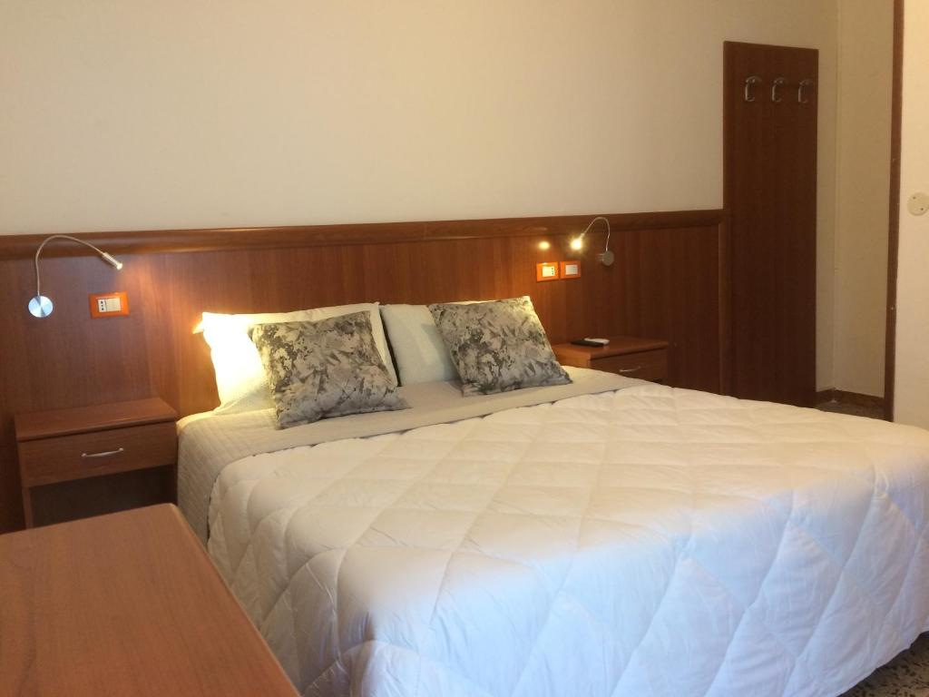 Postel nebo postele na pokoji v ubytování Hotel Portofino