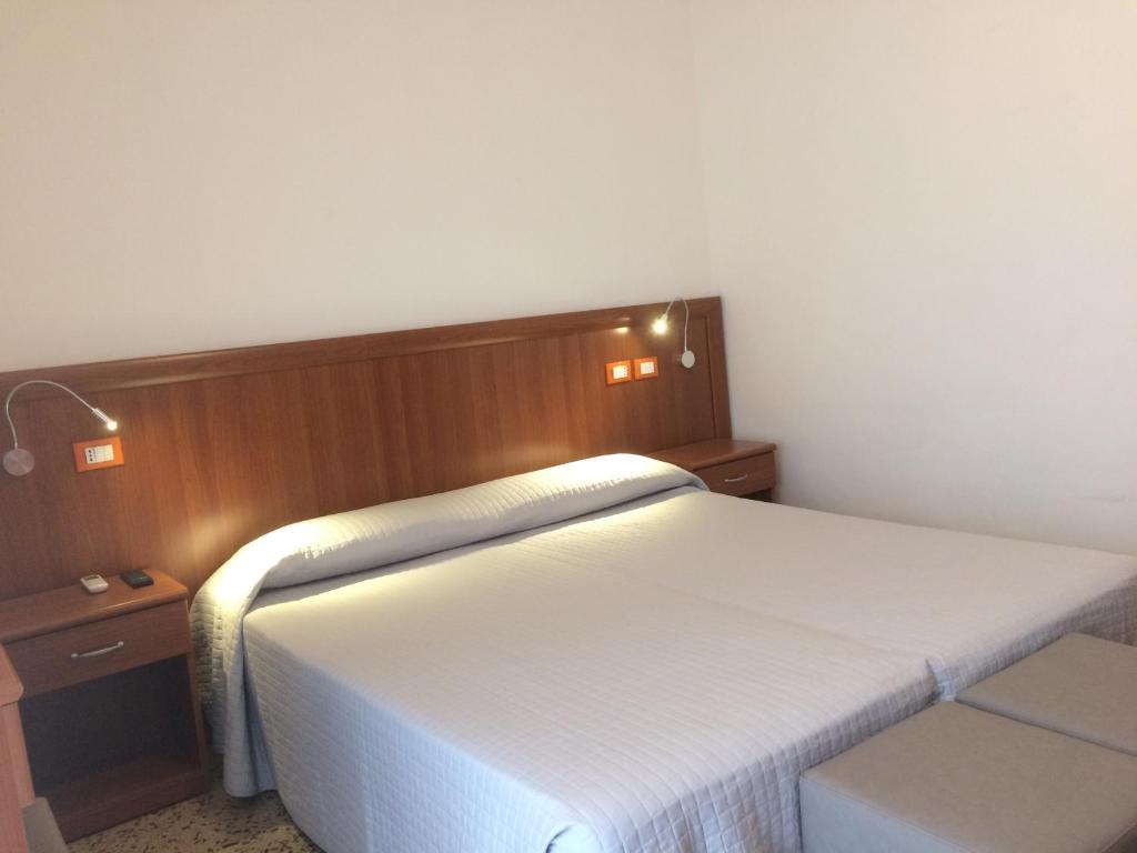 Postel nebo postele na pokoji v ubytování Hotel Portofino