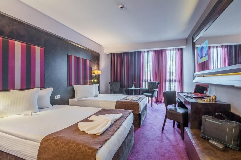 Postel nebo postele na pokoji v ubytování Best Boutique Hotel