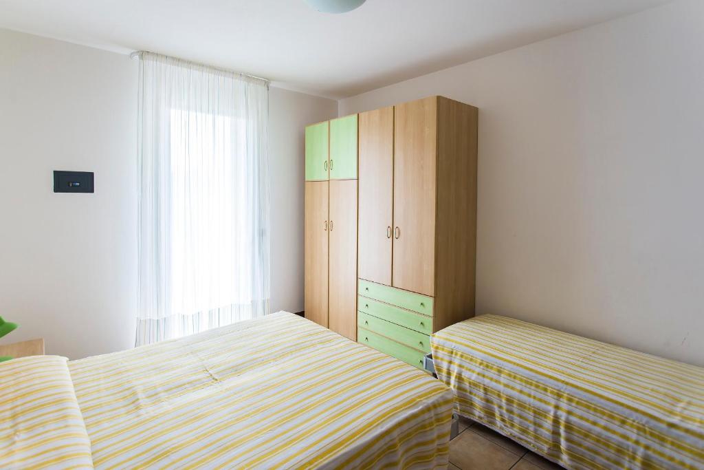 A bed or beds in a room at Villaggio Calycanthus