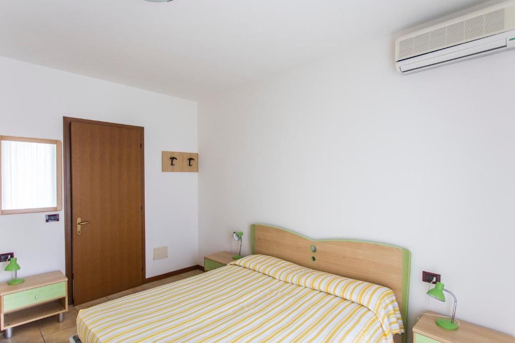 A bed or beds in a room at Villaggio Calycanthus
