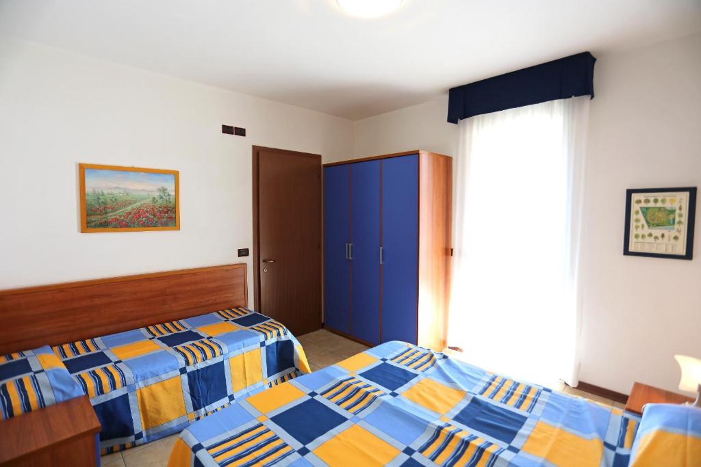 Posteľ alebo postele v izbe v ubytovaní Quercia Lido Altanea