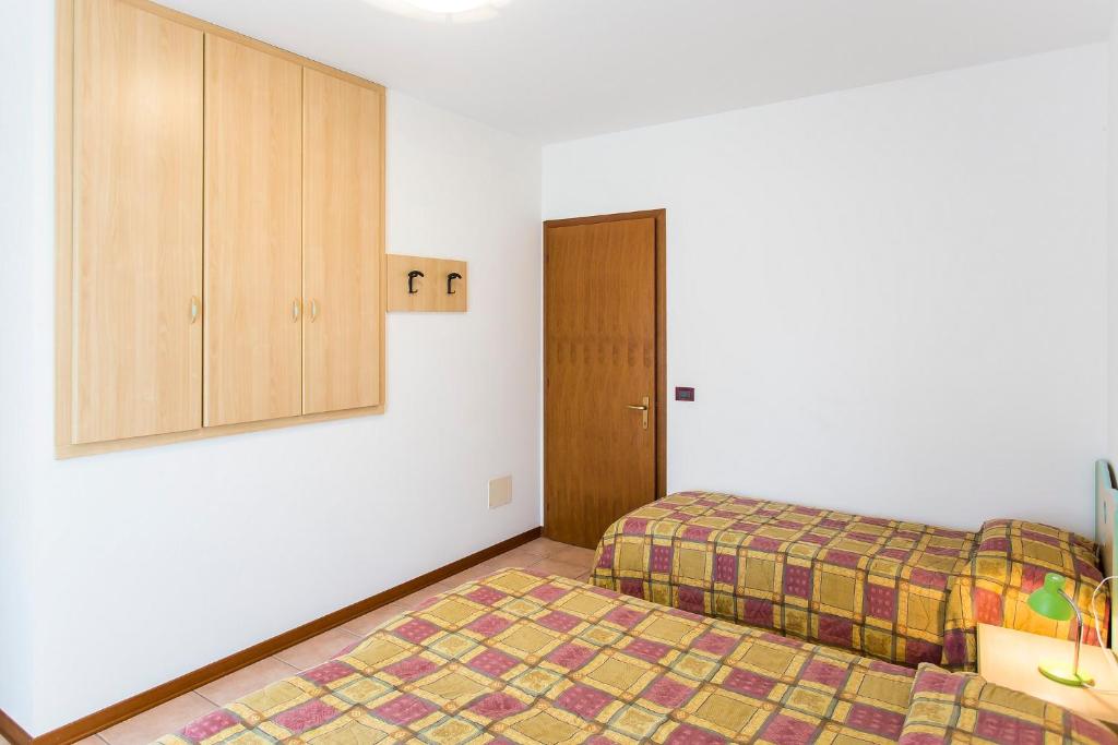A bed or beds in a room at Villaggio Calycanthus