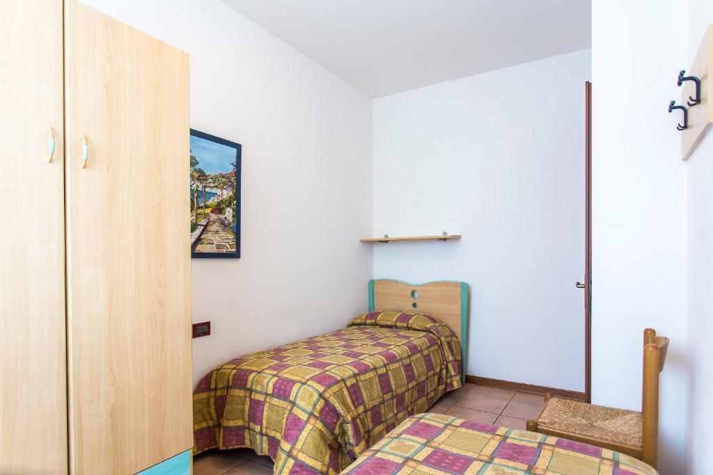 A bed or beds in a room at Villaggio Calycanthus