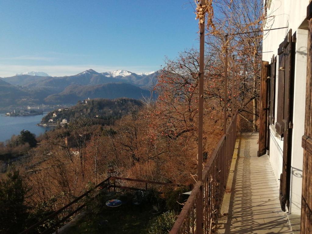 a balcony of a building with a view of a mountain at Balconata sul lago in Ameno