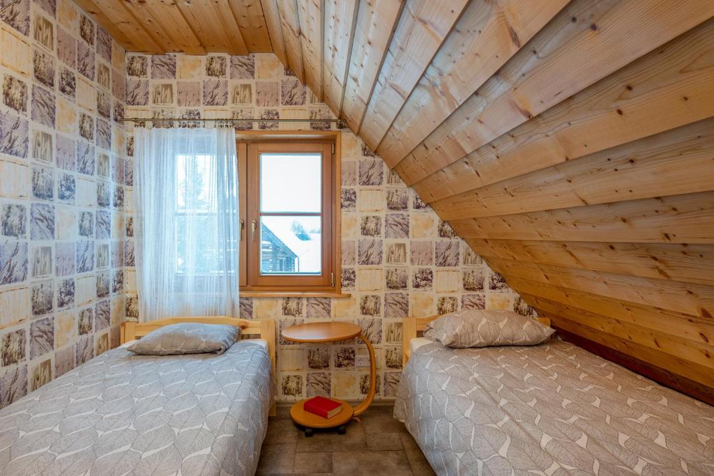 Postel nebo postele na pokoji v ubytování RosenHausen Puhkemajad