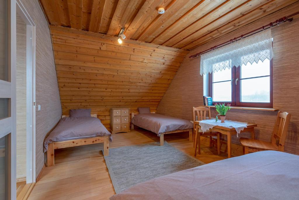 Postel nebo postele na pokoji v ubytování RosenHausen Puhkemajad