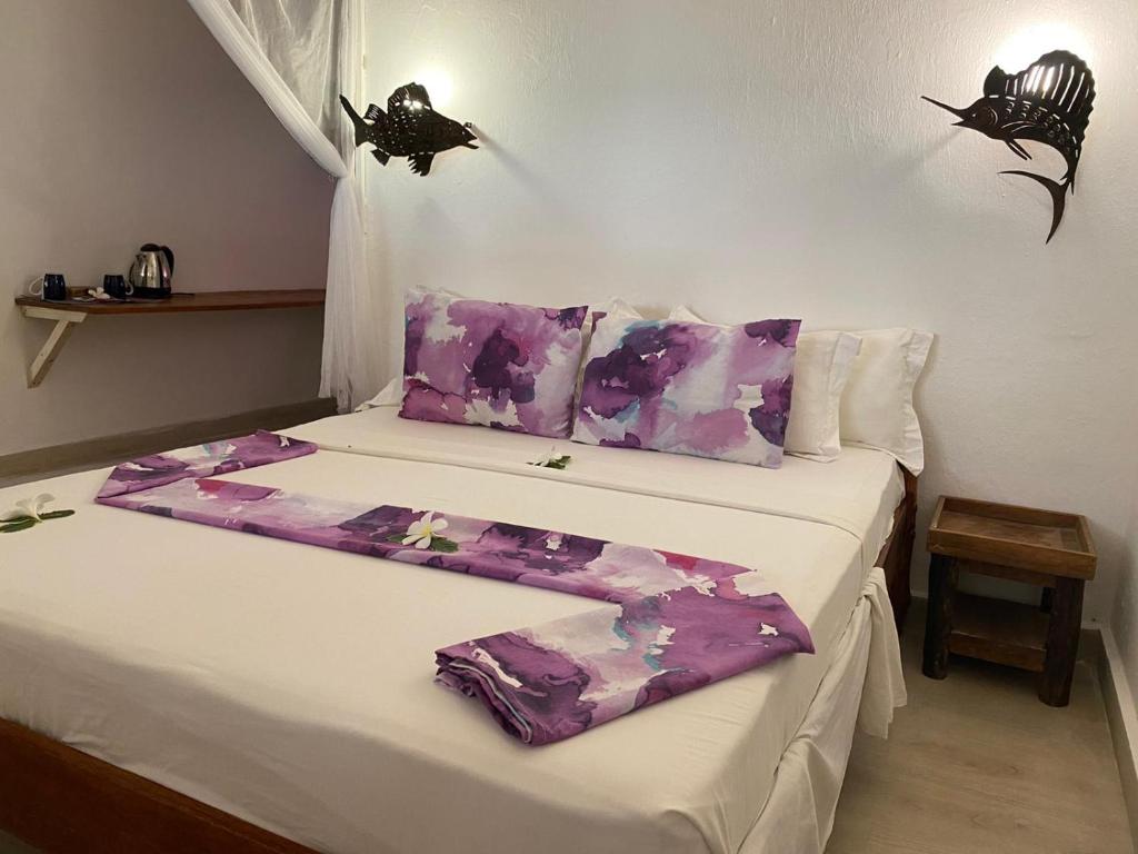 Postel nebo postele na pokoji v ubytování Karamba Eco Boutique Hotel