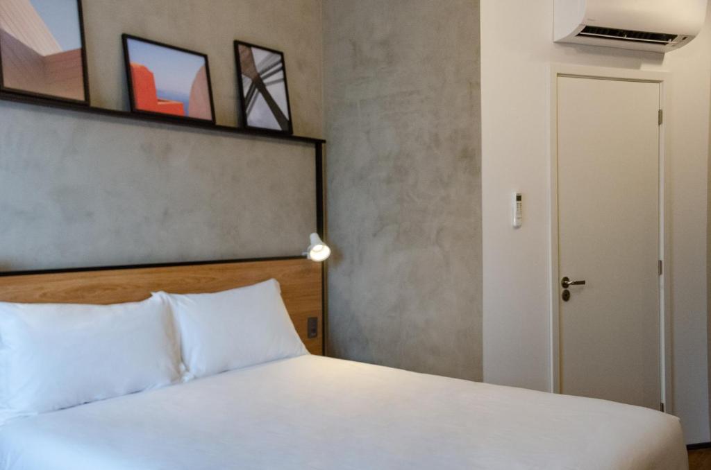 Postel nebo postele na pokoji v ubytování ibis Ponta Grossa