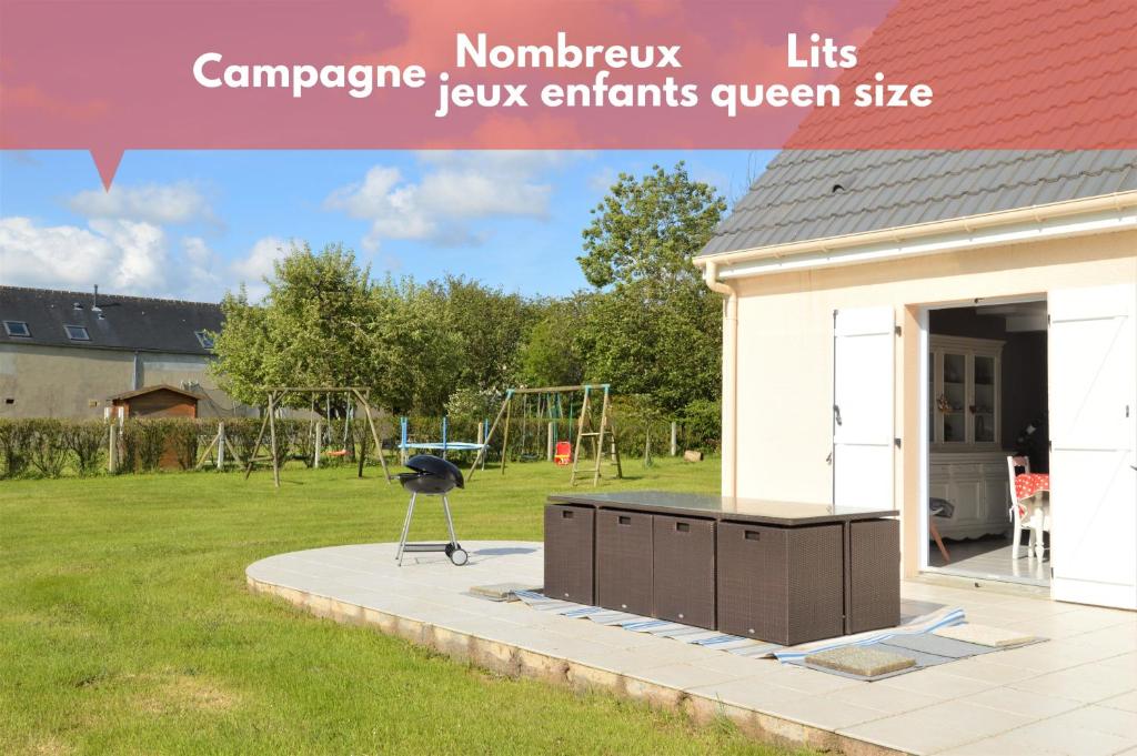 a view of a house with a playground in a yard at Maison confortable séjour spacieux, belle terrasse avec grand jardin avec jeux extérieurs près Bayeux et Omaha Beach in Saonnet