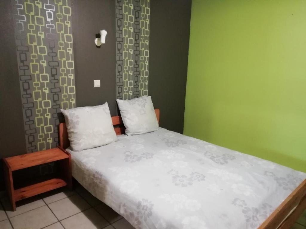 Postel nebo postele na pokoji v ubytování Hotel Dry Les Courtis