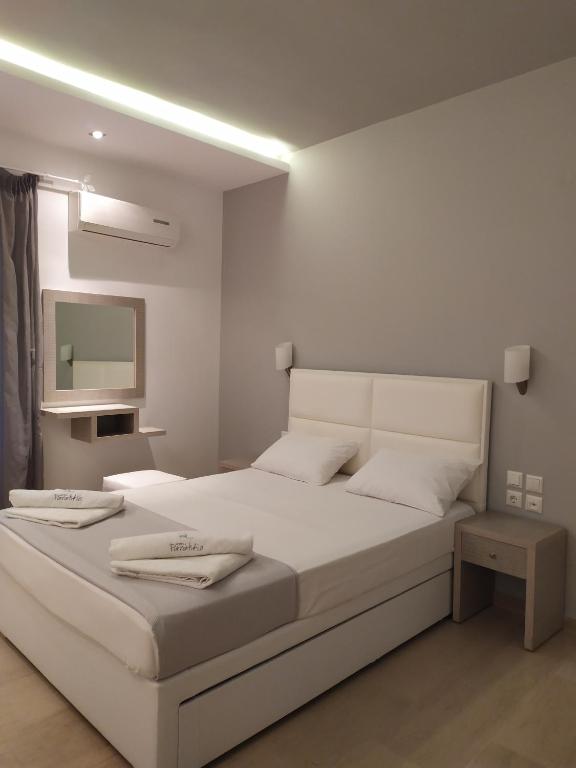 Postel nebo postele na pokoji v ubytování Hotel Paraktio
