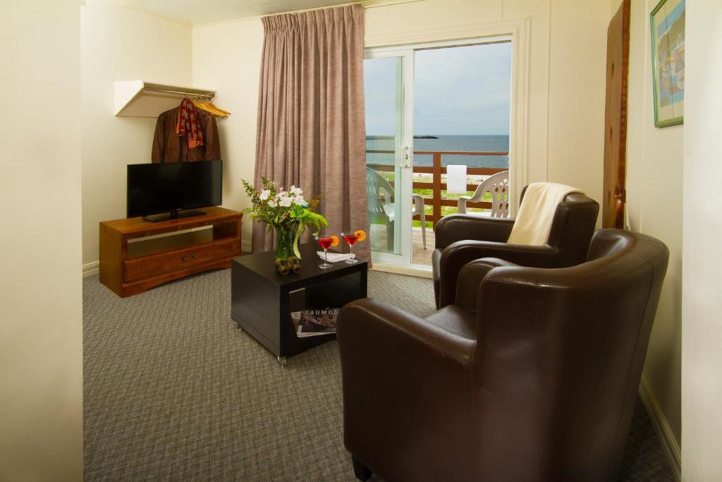 TV a/nebo společenská místnost v ubytování Hotel Motel Belle Plage