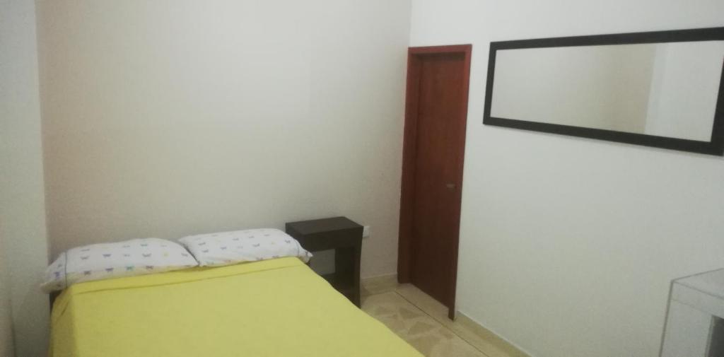 Postel nebo postele na pokoji v ubytování Hostal El Recreo