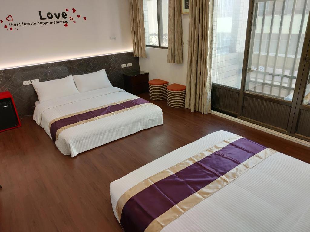 Postel nebo postele na pokoji v ubytování Purple Shell Homestay