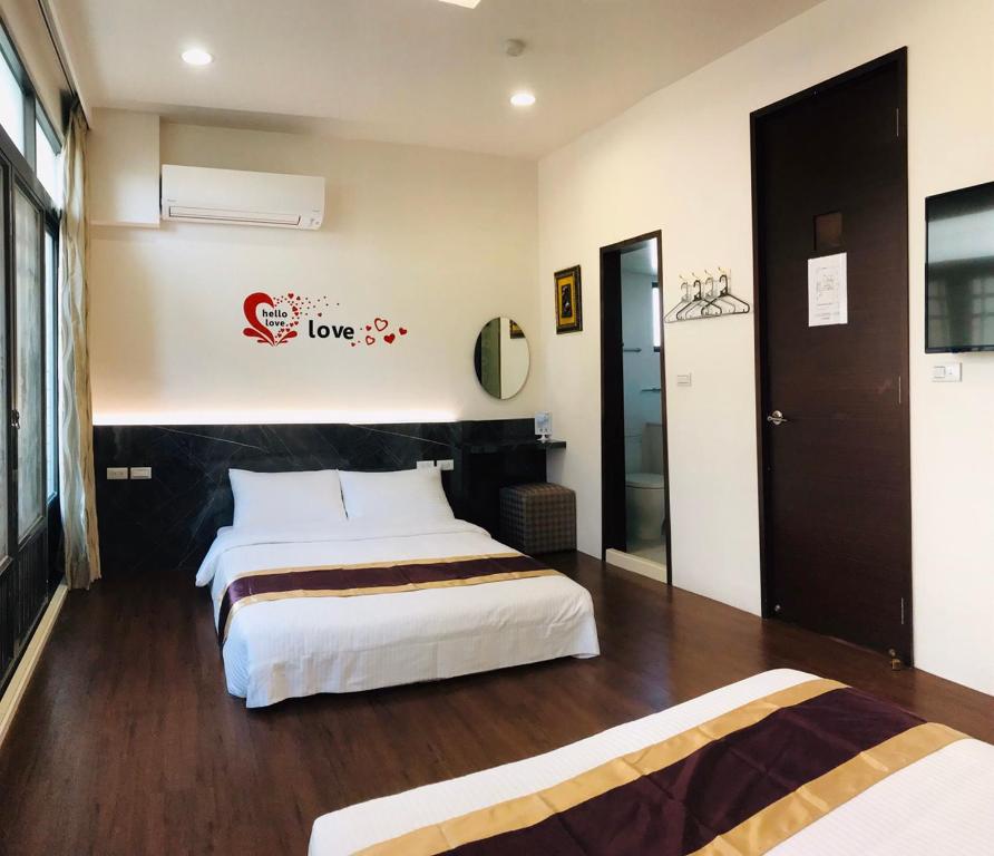 Postel nebo postele na pokoji v ubytování Purple Shell Homestay