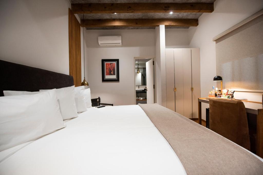 Postel nebo postele na pokoji v ubytování Hotel Madi