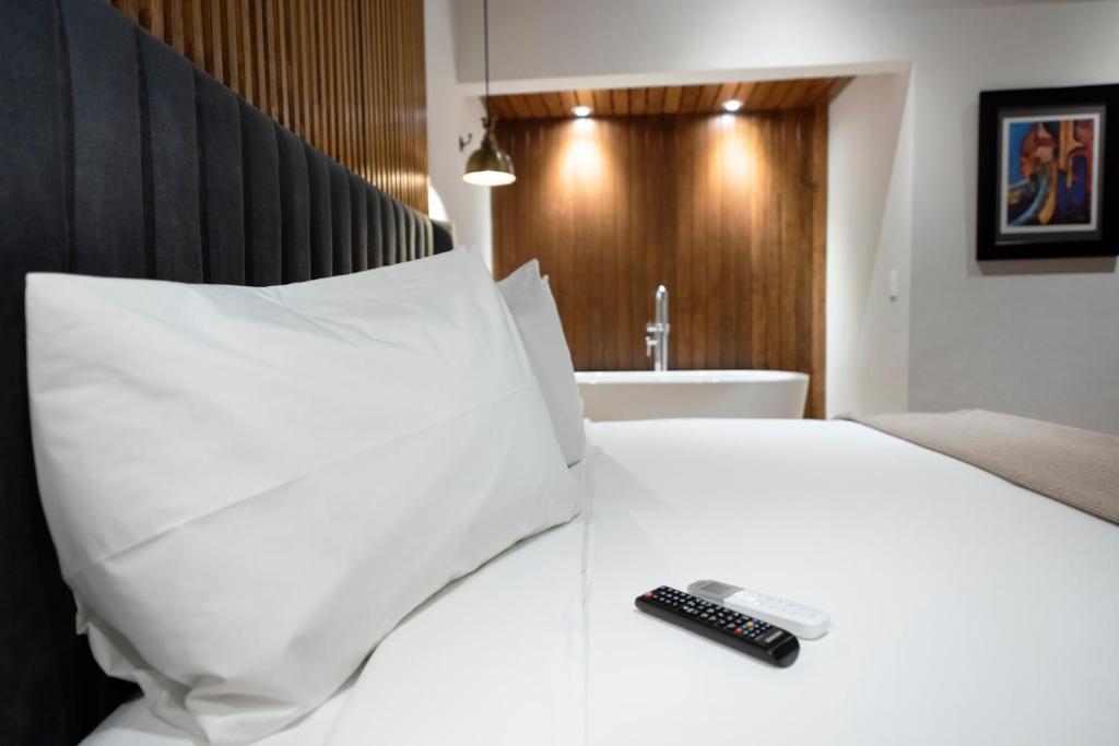 Postel nebo postele na pokoji v ubytování Hotel Madi