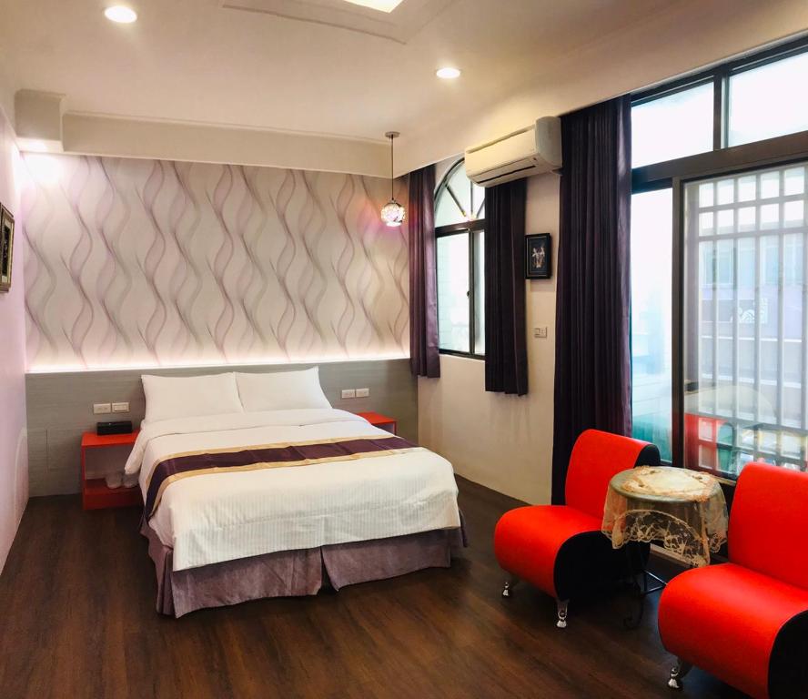 Postel nebo postele na pokoji v ubytování Purple Shell Homestay