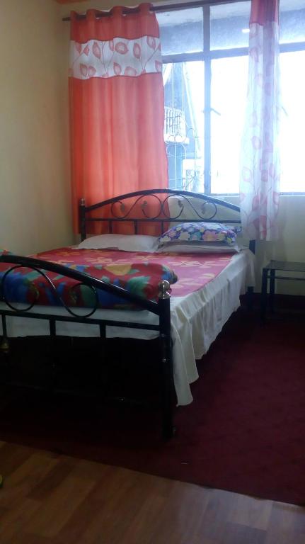 Postel nebo postele na pokoji v ubytování Backpackers Hostel