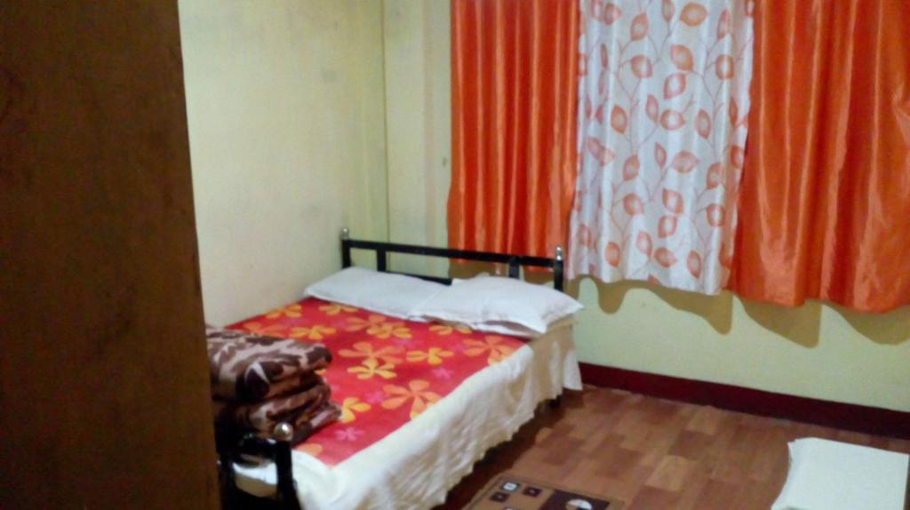 Postel nebo postele na pokoji v ubytování Backpackers Hostel