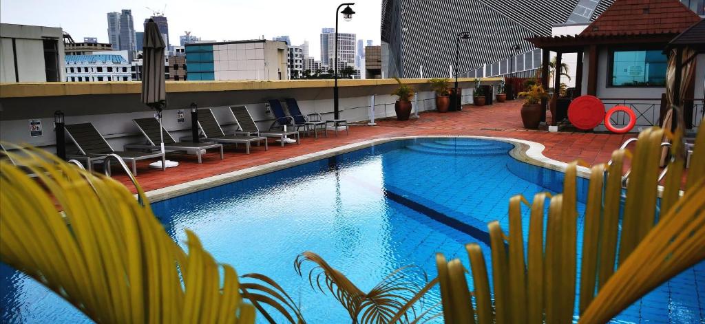 a swimming pool on top of a building at Orchard Point Serviced Apartments in Singapore