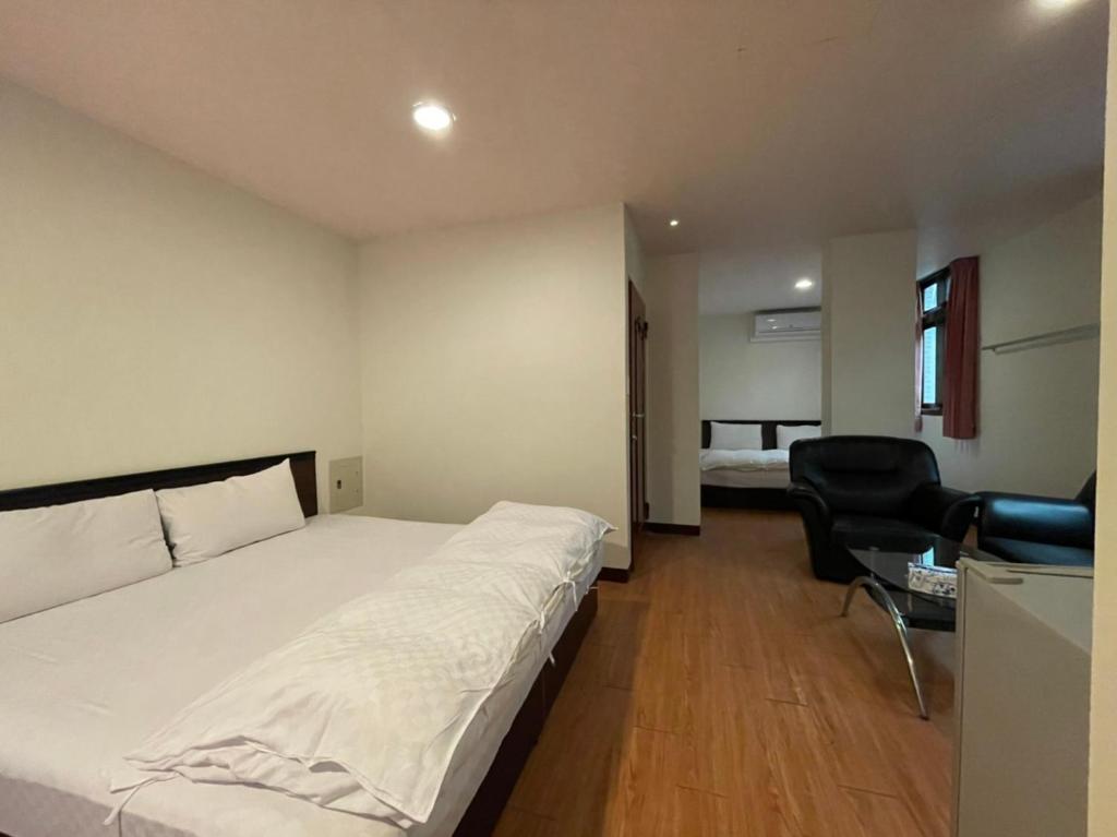 Postel nebo postele na pokoji v ubytování Da Fang Hotel