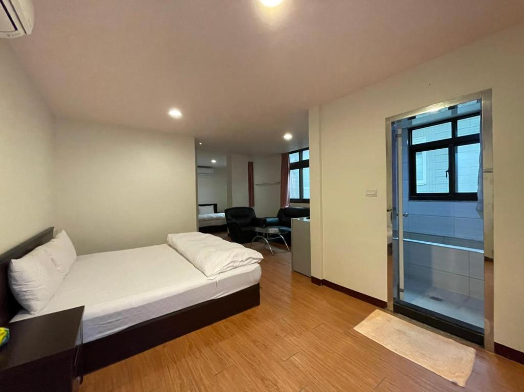 Postel nebo postele na pokoji v ubytování Da Fang Hotel