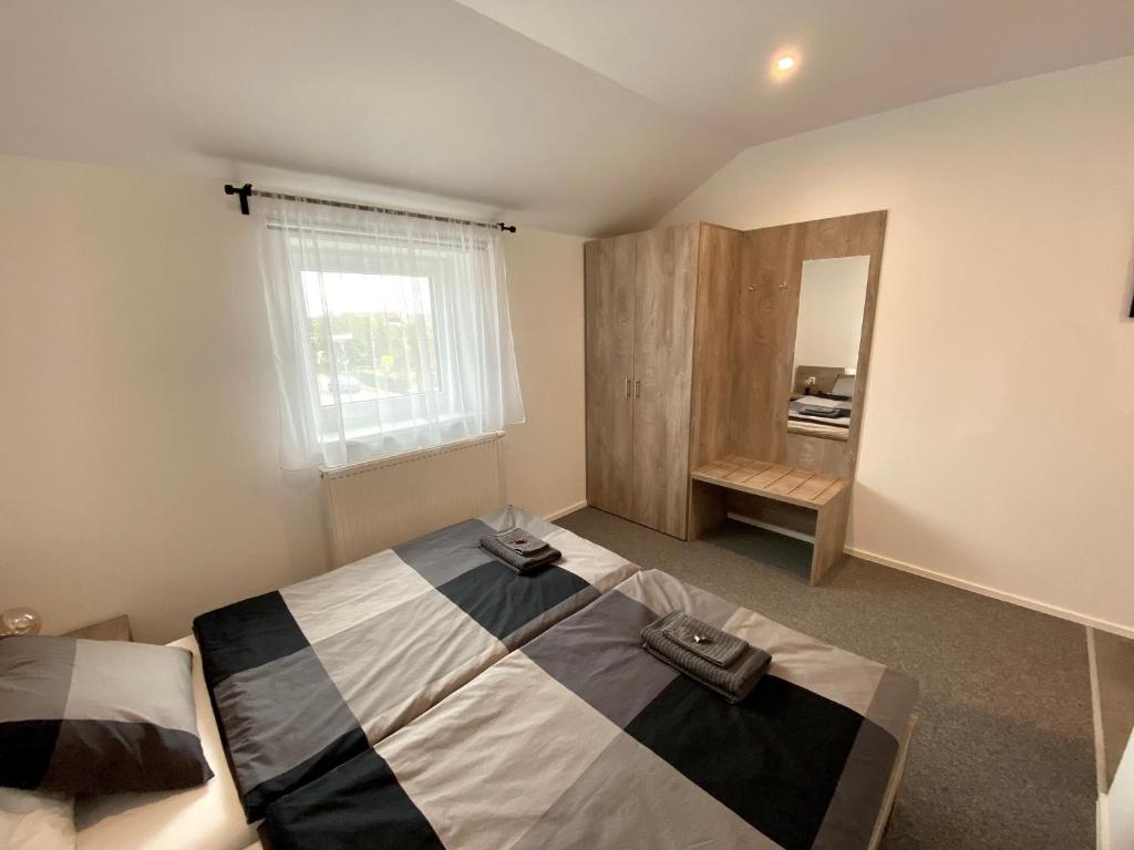 Postel nebo postele na pokoji v ubytování Apartmány Pelhřimov