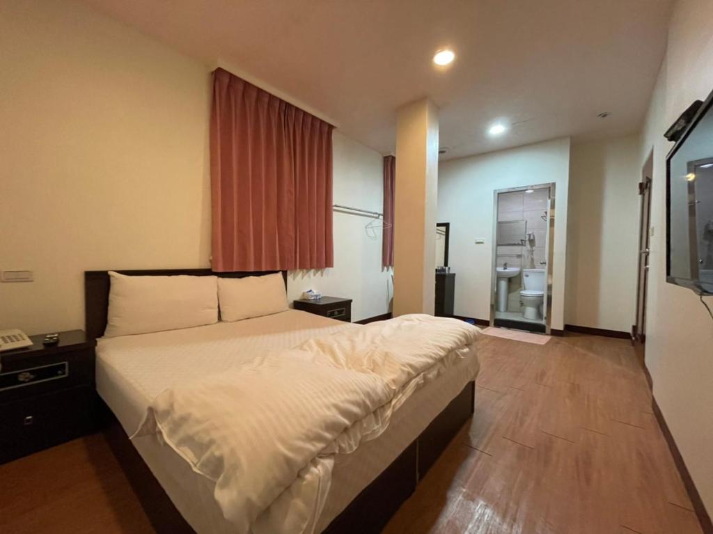 Postel nebo postele na pokoji v ubytování Da Fang Hotel