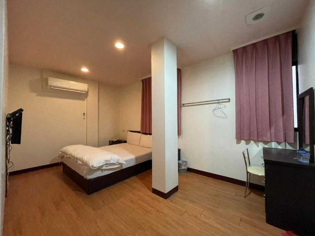 Postel nebo postele na pokoji v ubytování Da Fang Hotel