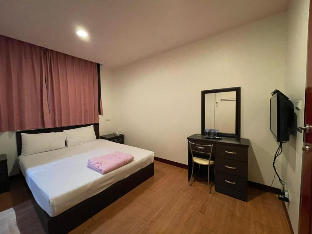 Postel nebo postele na pokoji v ubytování Da Fang Hotel