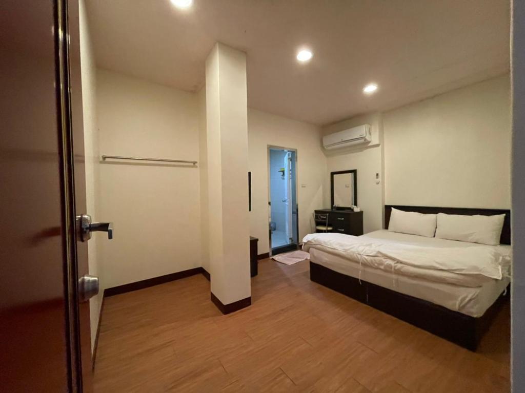 Postel nebo postele na pokoji v ubytování Da Fang Hotel