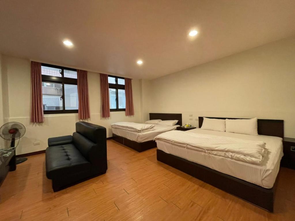 Postel nebo postele na pokoji v ubytování Da Fang Hotel