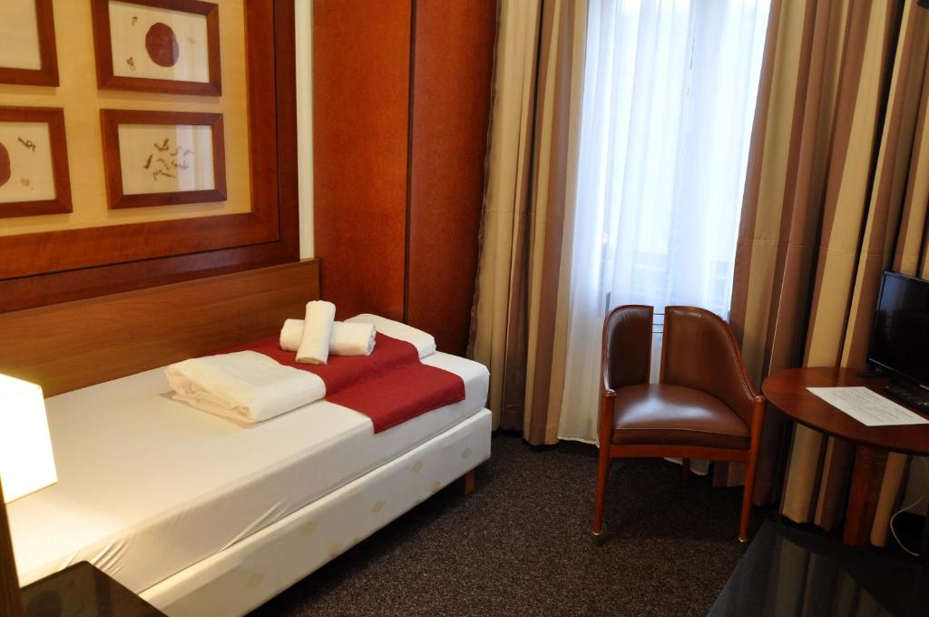 Postel nebo postele na pokoji v ubytování Hotel U Bílého koně