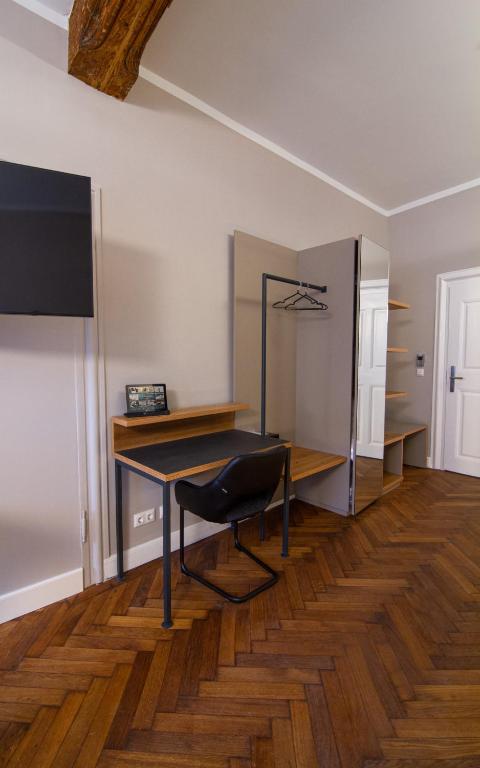 TV a/nebo společenská místnost v ubytování Le Baldinger Boutique Hotel