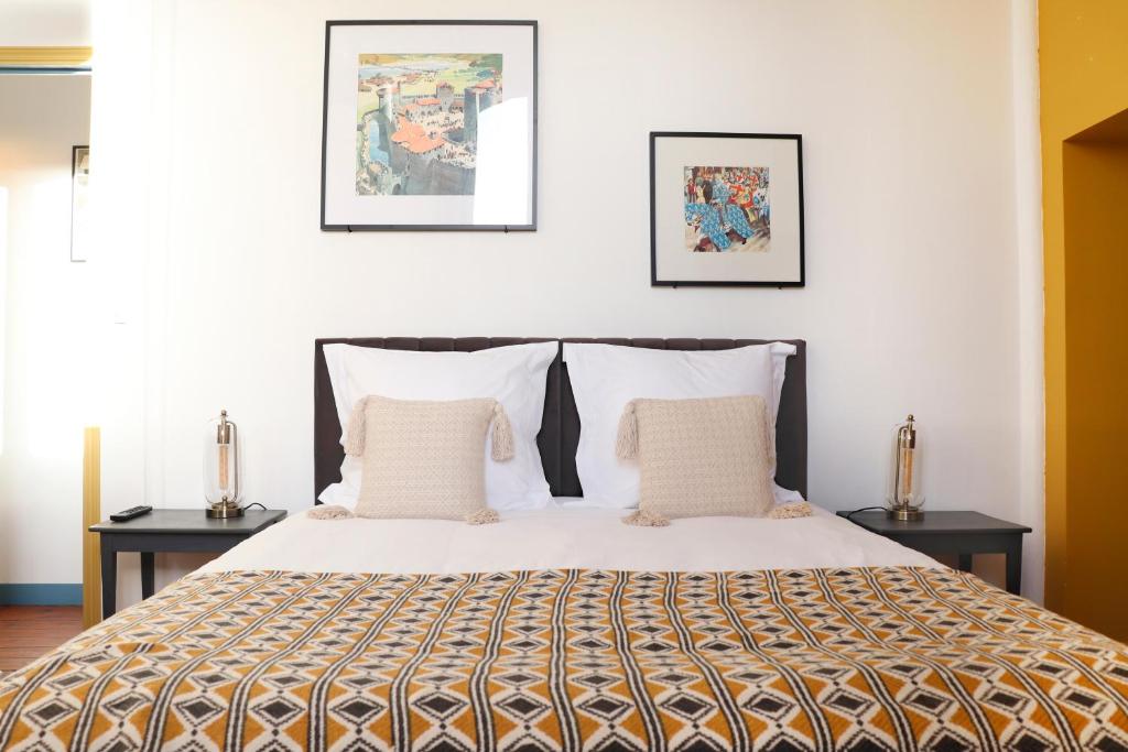 Postel nebo postele na pokoji v ubytování La Récréation - Chambres et Appartements