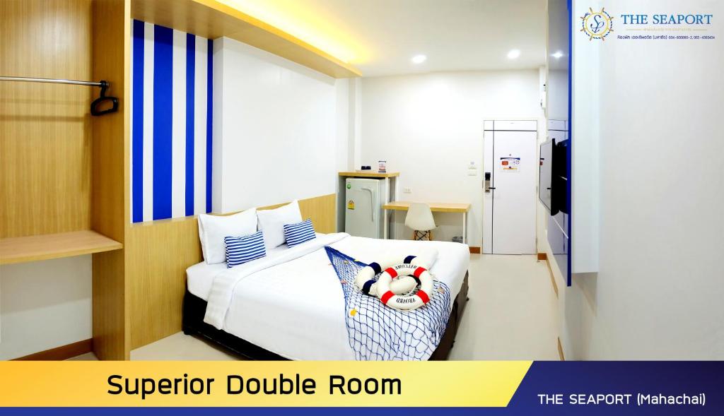 Postel nebo postele na pokoji v ubytování THE SEAPORT Hotel โรงแรมเดอะซีพอร์ต