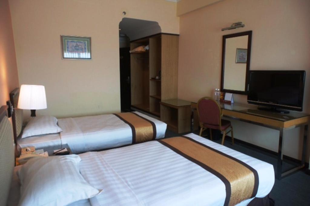TV a/nebo společenská místnost v ubytování Tyng Garden Hotel