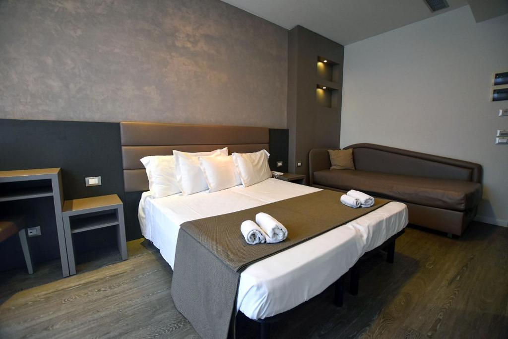 Postel nebo postele na pokoji v ubytování Hotel Aurora