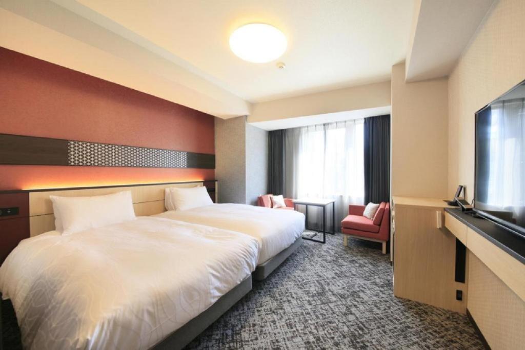 Ένα ή περισσότερα κρεβάτια σε δωμάτιο στο Keisei Richmond Hotel Tokyo Monzennakacho