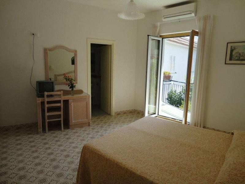 Postel nebo postele na pokoji v ubytování Hotel Candia