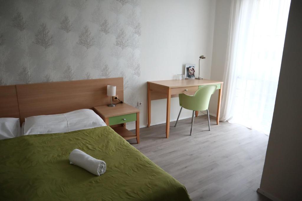 Postel nebo postele na pokoji v ubytování Hotel and Park Divoká Voda