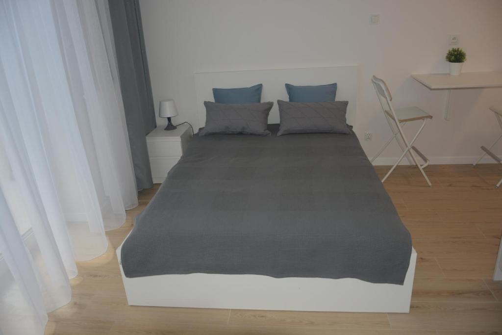 Posteľ alebo postele v izbe v ubytovaní Apartament Royal Place II Jurowiecka 17