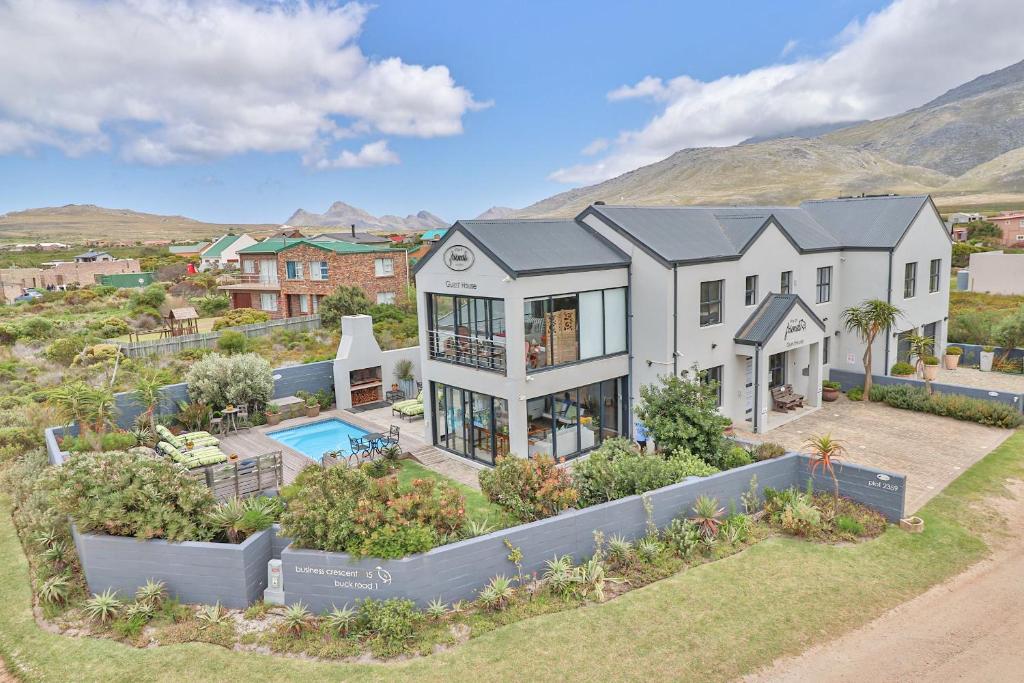 an aerial view of a house with a pool at Stay At Friends in Bettyʼs Bay