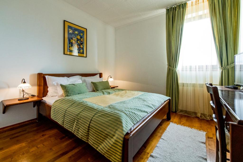 Postel nebo postele na pokoji v ubytování Hotel Sunce Vlašić